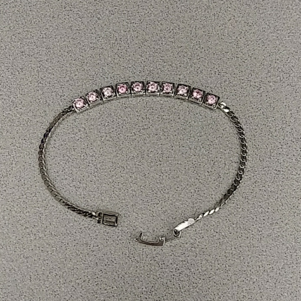 Silver bracelet with pink stones